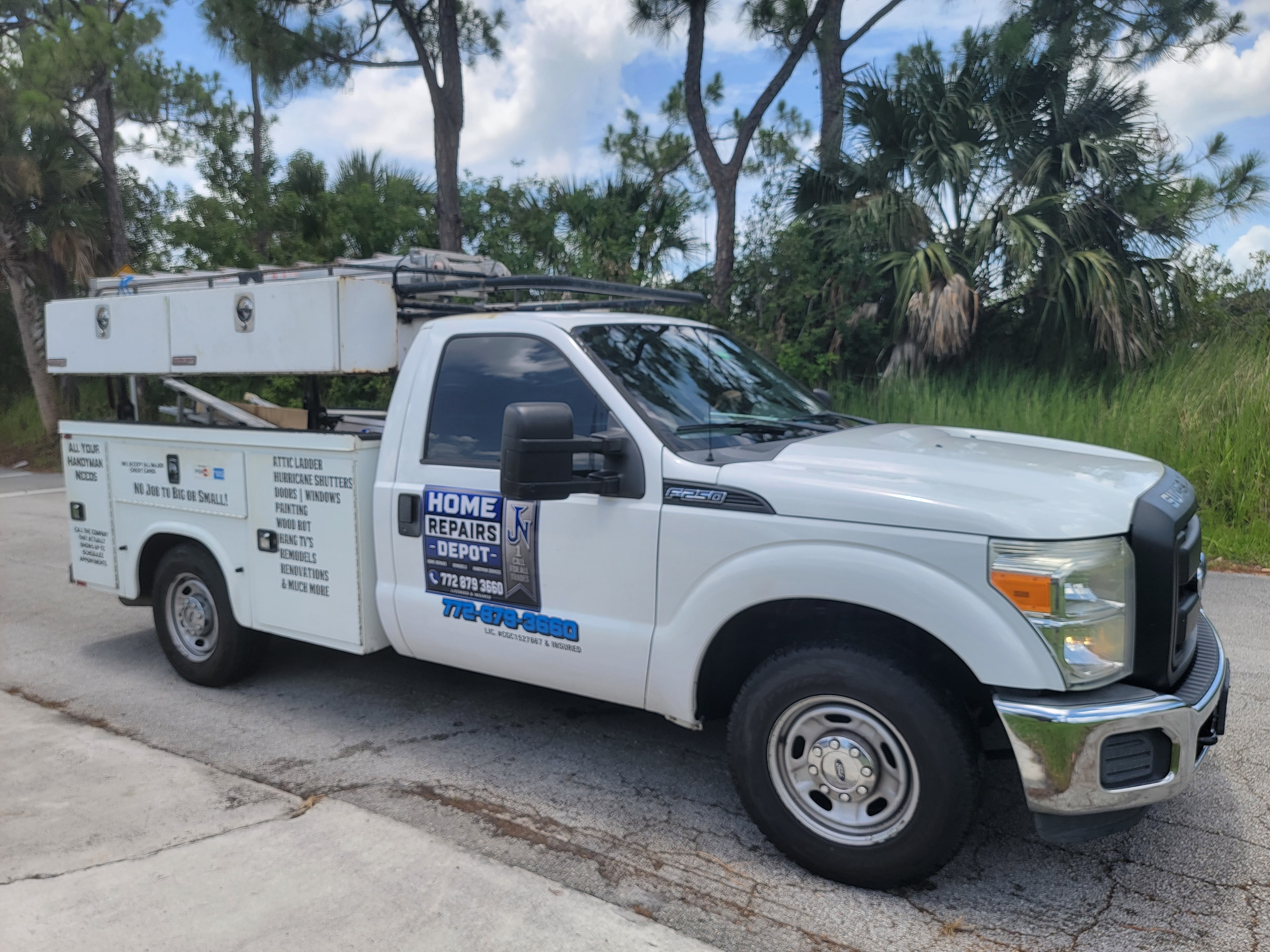 Home Repairs Experts service truck — Home Repairs, Remodels, Handyman Services. Licensed & Insured. 772-879-3660.